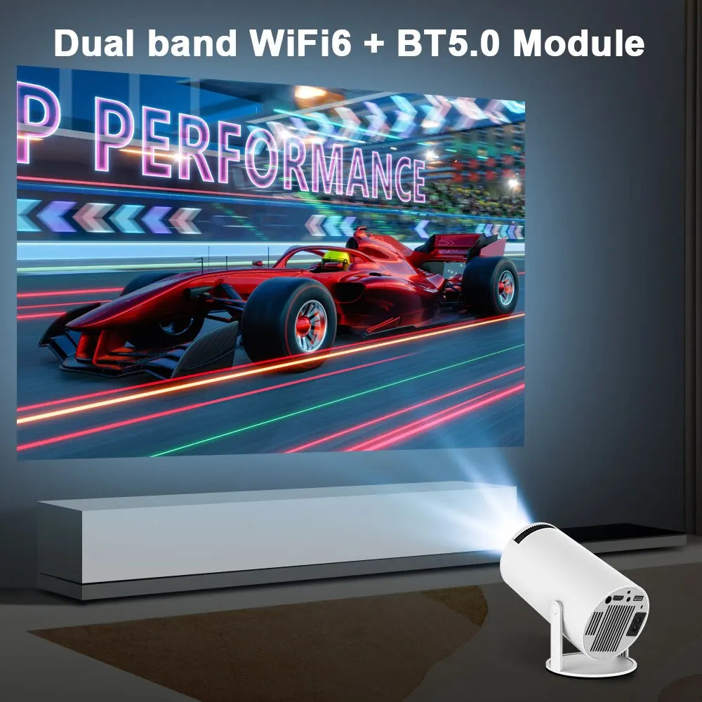 A projector projecting a picture of a race car onto a large screen. Text overlayed on the projector advertises features including 'Dual band WiFi6 + BT5.0 Module' and 'P PERFORMANCE.'